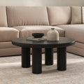 Table basse scandinave en bois massif noir avec plateau rond et pieds creux pour le salon