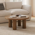 Table basse scandinave en chêne fumé avec plateau rond et pieds évidés pour salon