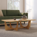 Table basse moderne en chêne naturel avec piètement sculptural en arche et bords biseautés pour le salon