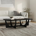 Table basse moderne noire en bois massif avec base sculpturale en arche et bords biseautés pour le salon