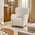 Fauteuil de salon contemporain blanc en tissu bouclé avec dossier haut et assise profonde pour le salon