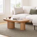Table basse ovale en chêne naturel avec pieds cylindriques pour salon